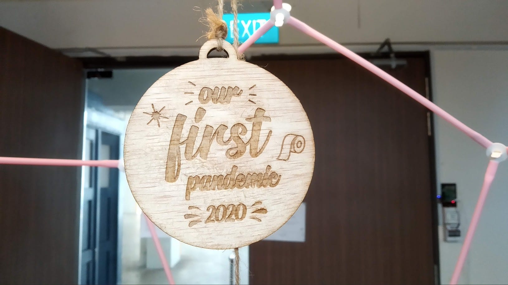 A bauble I designed in Inkscape and cut out with the laser cutter, now hanging at the office entrance.