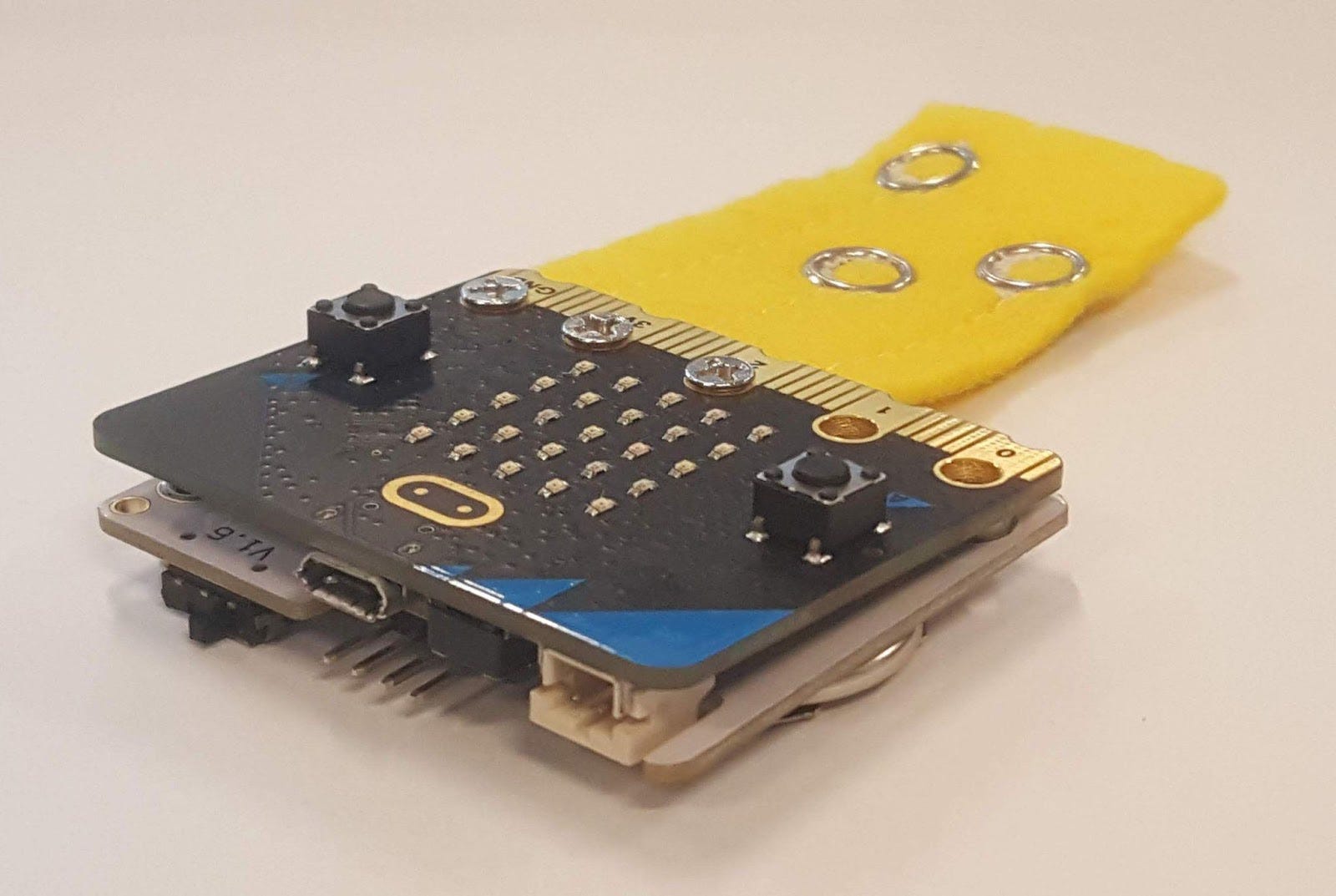 A micro:bit attached to a power:bit.