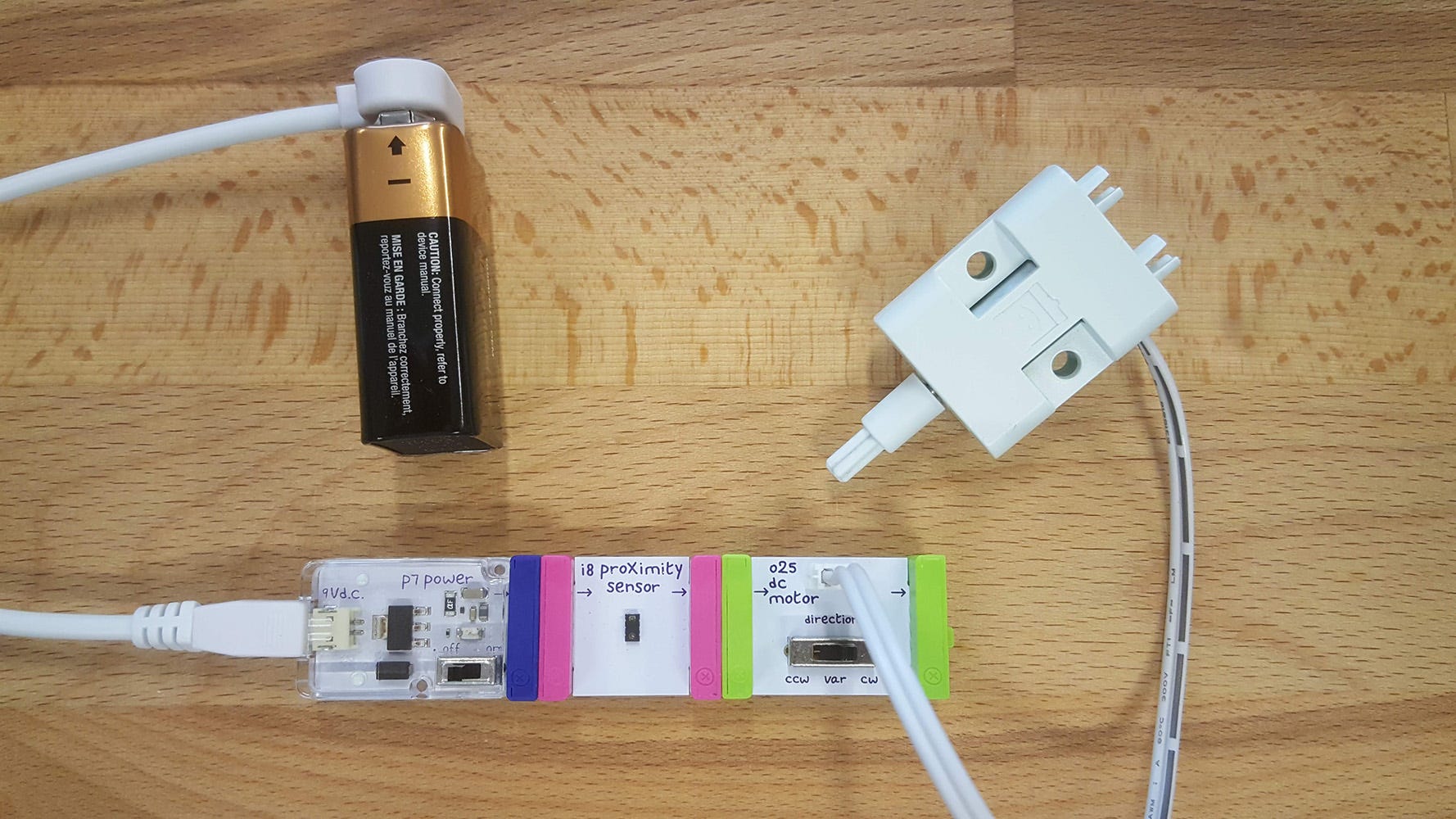 LittleBits battery, proximity sensor and motor connected to a paper automaton