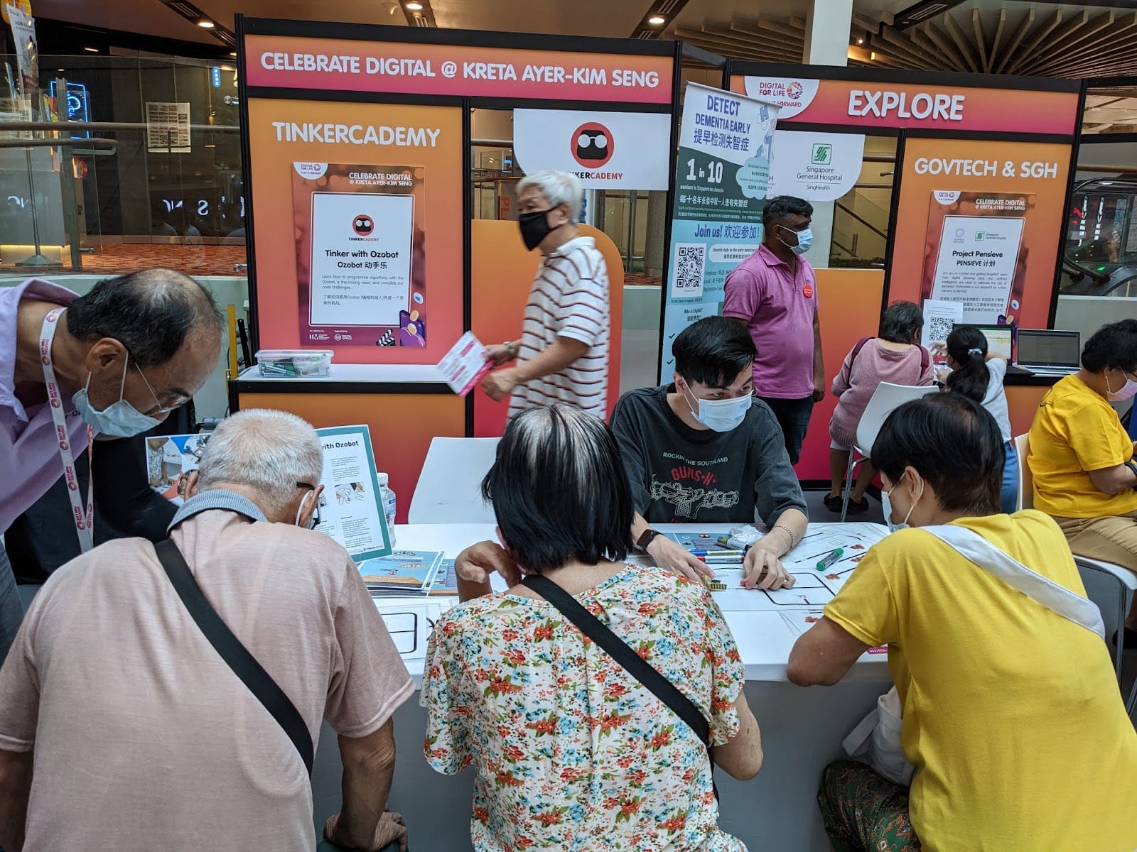Singaporeans of all ages trying out our CS Unplugged activities!
