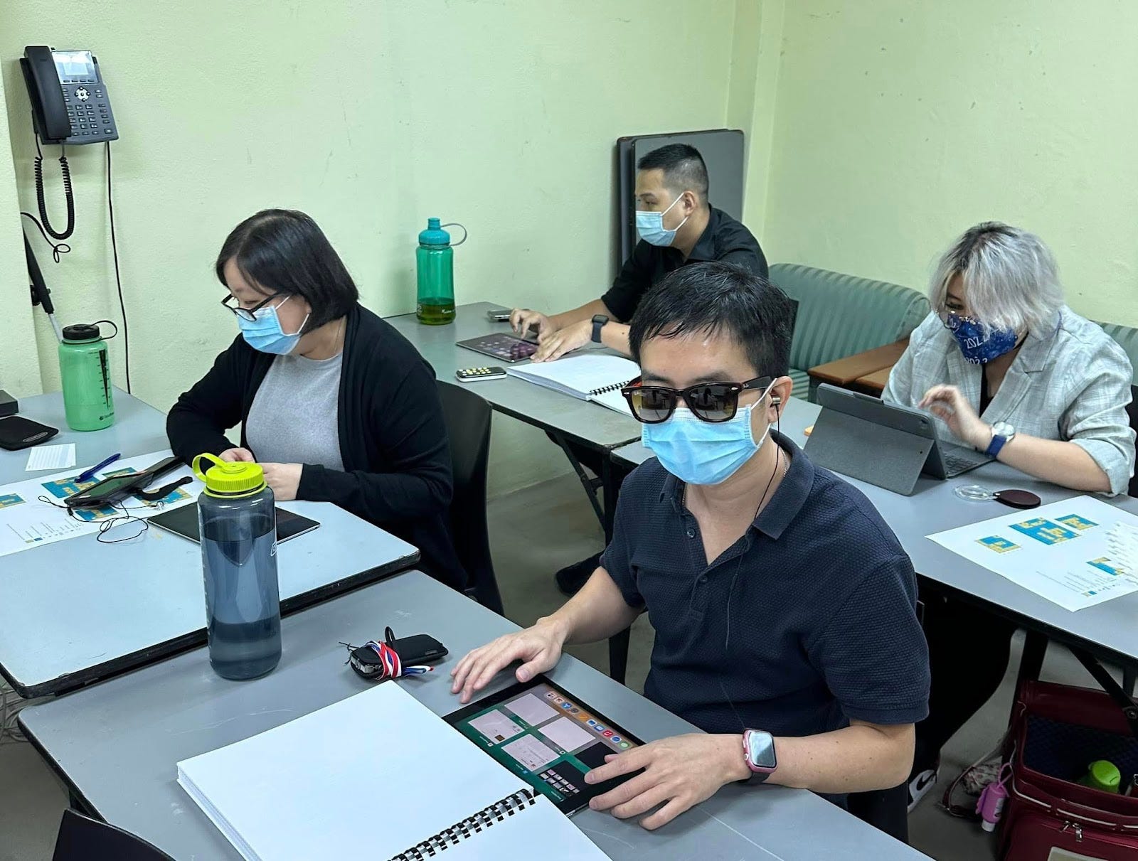 Participants using various ground-breaking accessibility technologies to solve a range of coding puzzles.