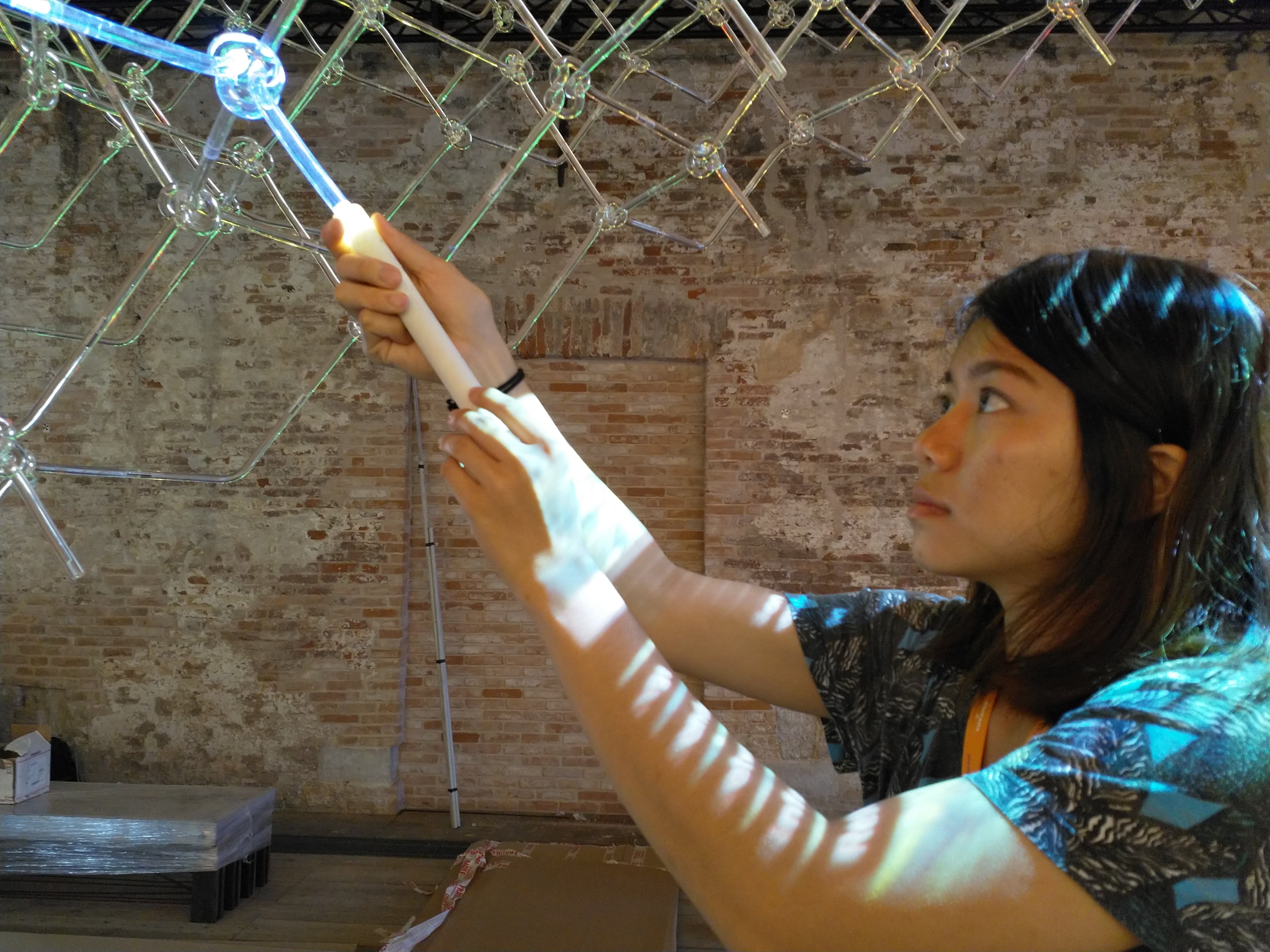 Out in the wild — Inez gingerly tries unsheathing a light stick
